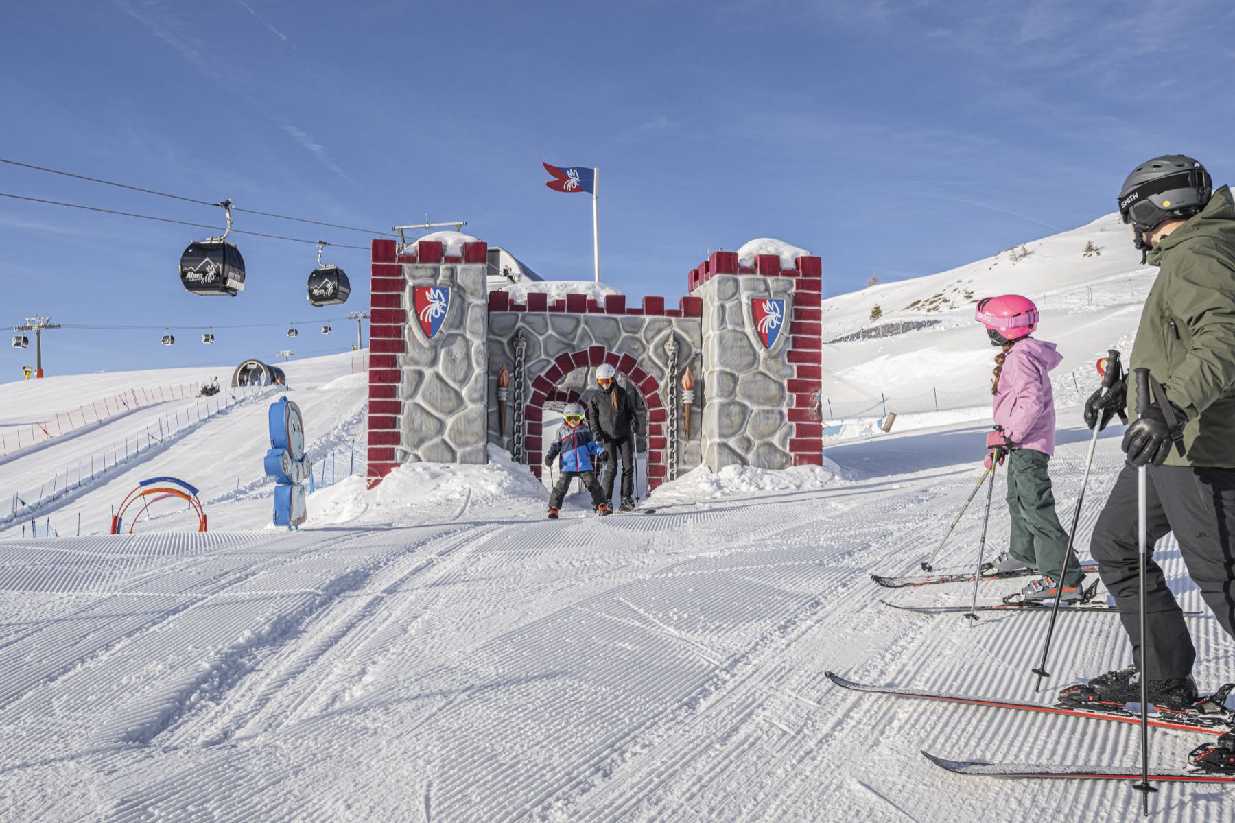 A family skiing in the Dolomites