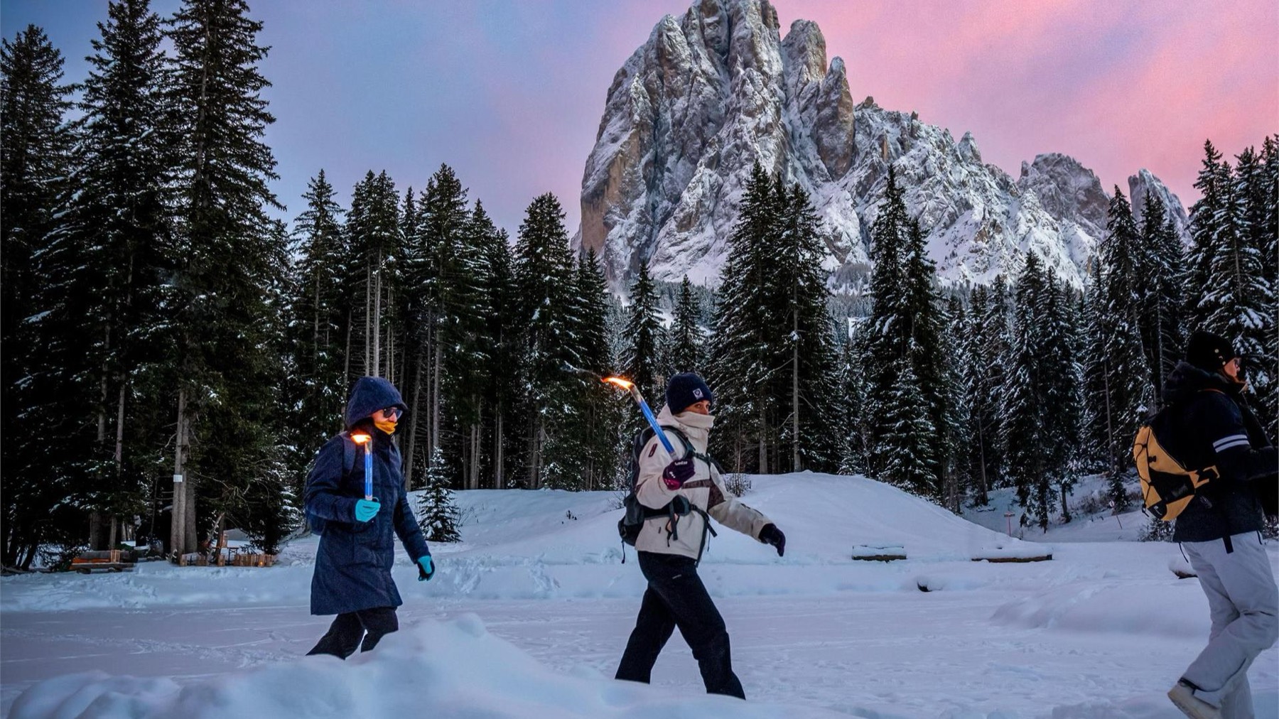 Torchlit snowshoe walk at Monte Pana