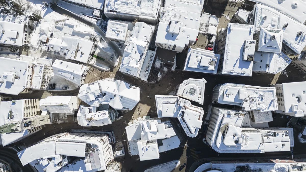 Snow-covered St. Moritz rooftops seen from directly above