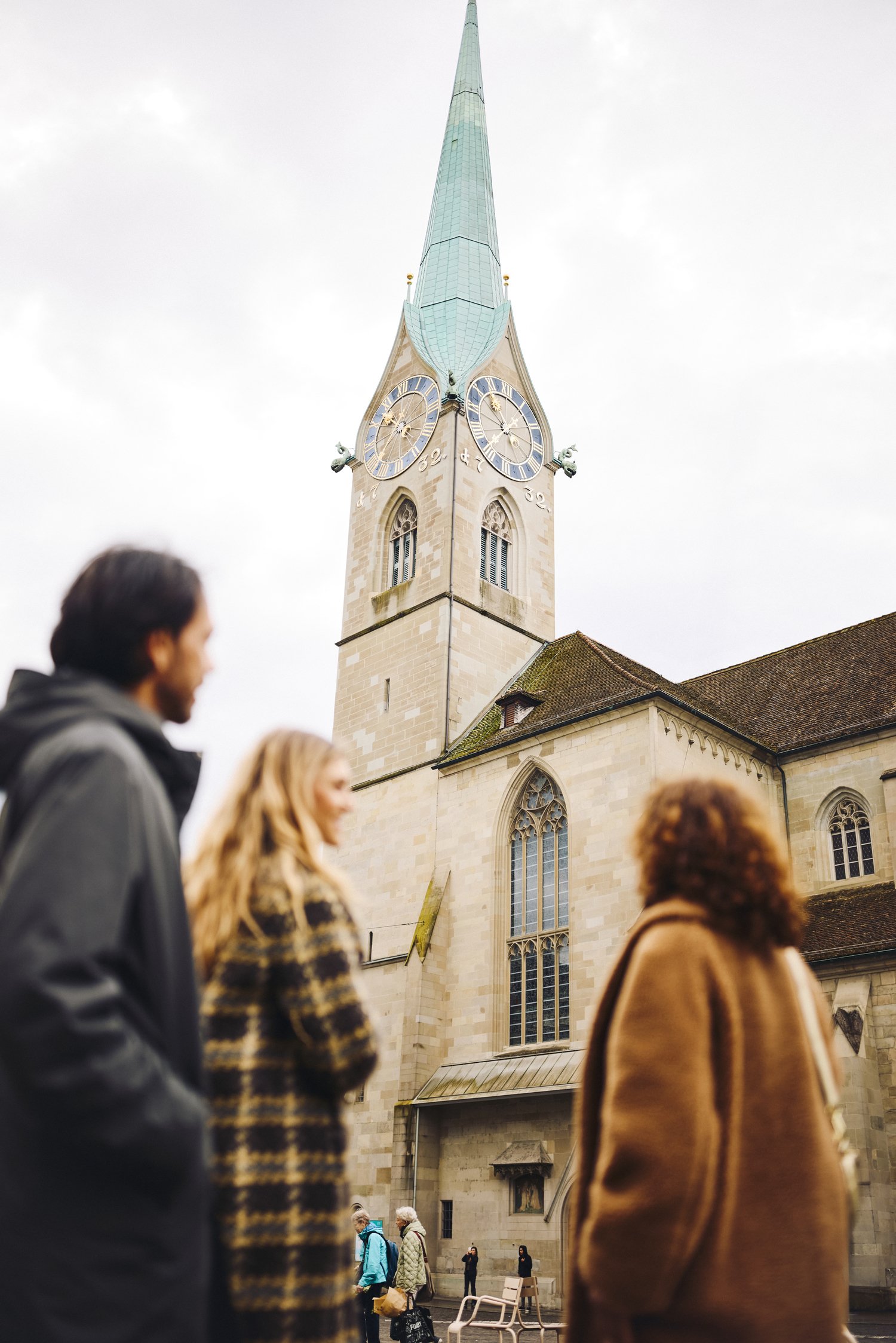 A small group with a guide outside the Fraumünster Church