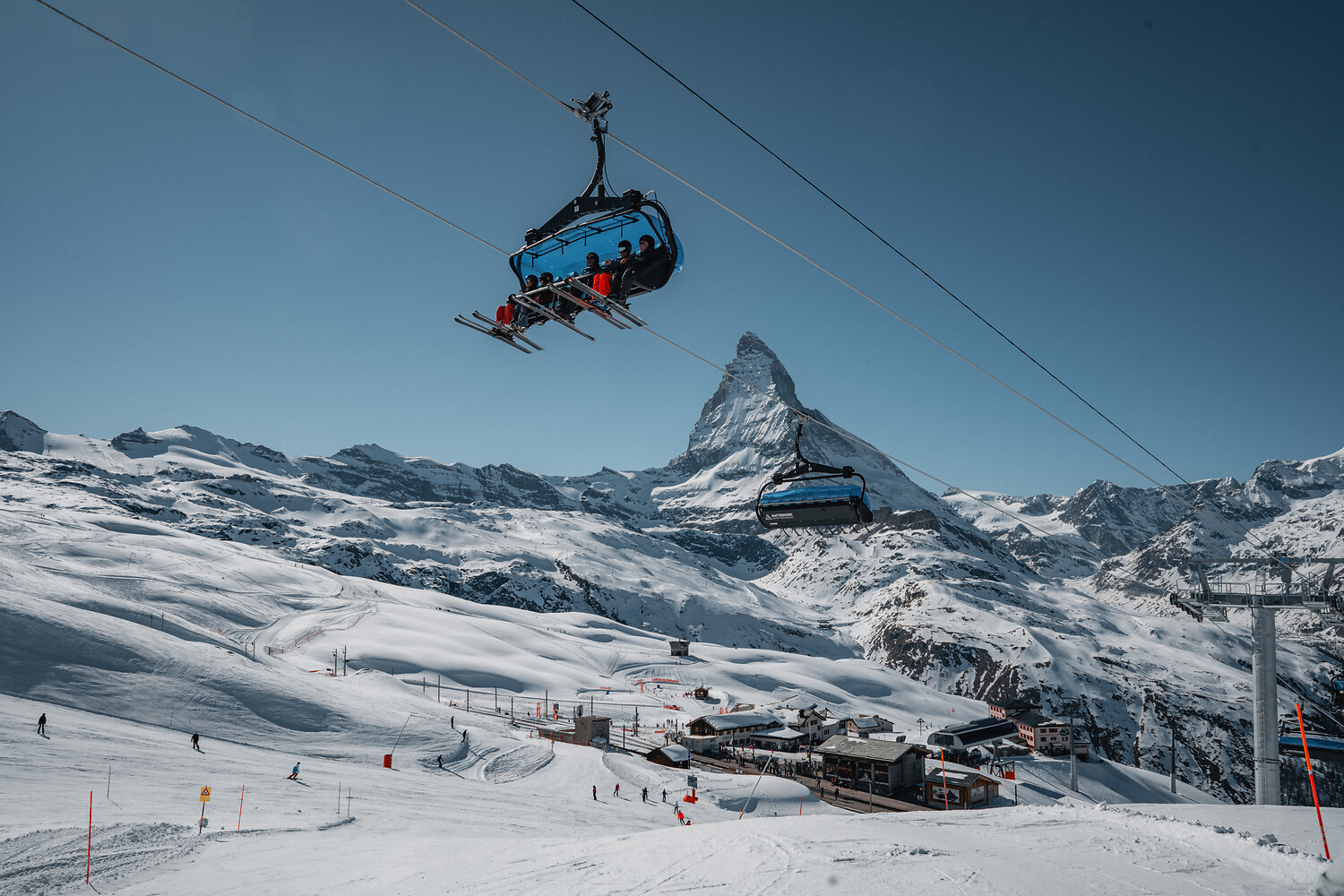 A chairlift rising toward the Matterhorn above Zermatt
